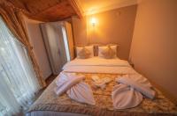 Postel nebo postele na pokoji v ubytování Ağva Carpediem Otel