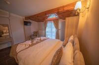 Postel nebo postele na pokoji v ubytování Ağva Carpediem Otel