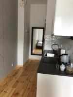 Kuchyňa alebo kuchynka v ubytovaní Apartamenty Mikubo Wrocław