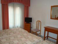 A television and/or entertainment centre at Hostal Universal