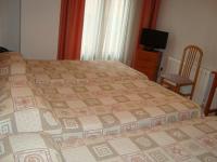 A bed or beds in a room at Hostal Universal