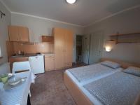 Posteľ alebo postele v izbe v ubytovaní Família Apartmanház
