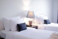 Postel nebo postele na pokoji v ubytování La Mai Hotel