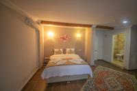 Postel nebo postele na pokoji v ubytování Ağva Carpediem Otel
