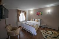 Postel nebo postele na pokoji v ubytování Ağva Carpediem Otel