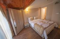 Postel nebo postele na pokoji v ubytování Ağva Carpediem Otel