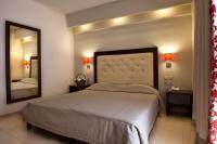 Posteľ alebo postele v izbe v ubytovaní Marilena Hotel