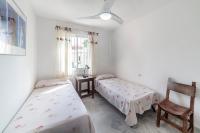 A bed or beds in a room at Residencial Las Redes - 19