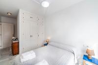 A bed or beds in a room at Residencial Las Redes - 19