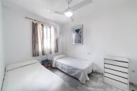 A bed or beds in a room at Residencial Las Redes - 19
