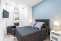 Postel nebo postele na pokoji v ubytování Plaza Mayor Apartment