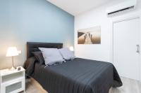 Postel nebo postele na pokoji v ubytování Plaza Mayor Apartment
