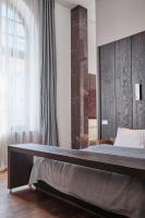 Łóżko lub łóżka w pokoju w obiekcie Hotel Monopol
