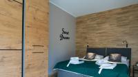 Łóżko lub łóżka w pokoju w obiekcie Apartament MOUNTSEA ,Karpacz Ogrodnicza