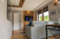 Telewizja i/lub zestaw kina domowego w obiekcie Apartament MOUNTSEA ,Karpacz Ogrodnicza