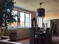 a living room with a table and chairs in a room at TOPFLOOR Les Terrasses in Dieppe