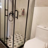 a bathroom with a shower with a toilet at Taroko Susi Space in Xincheng
