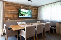 A television and/or entertainment centre at Alp-IN Lodges Kaprun