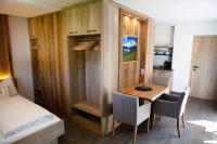 A bed or beds in a room at Alp-IN Lodges Kaprun
