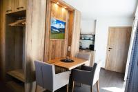 A television and/or entertainment centre at Alp-IN Lodges Kaprun