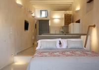 Posteľ alebo postele v izbe v ubytovaní Esperia Luxury Suites