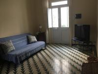 Televízia a/alebo spoločenská miestnosť v ubytovaní Casa Gaetano
