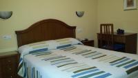Posteľ alebo postele v izbe v ubytovaní Hostal Guzman El Bueno by gaiarooms