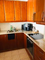 A kitchen or kitchenette at Cozy Apartment in District 8
