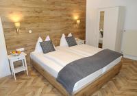 A bed or beds in a room at Villa Bucher - Metnitztalerhof