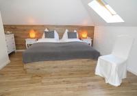 A bed or beds in a room at Villa Bucher - Metnitztalerhof