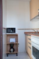 A kitchen or kitchenette at Fuentepark Apartments