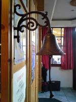 a bell hanging on the side of a building at Hotel Val Joly in Saint-Gervais-les-Bains