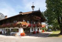 a house with flowers on the front of it at Appartement Oberlacken in Sankt Johann in Tirol