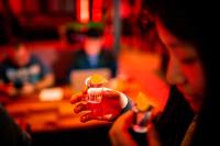 a woman holding a small object in her hand at Kick Ass Greyfriars (18+) in Edinburgh