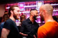 a group of men standing in a bar at Kick Ass Greyfriars (18+) in Edinburgh