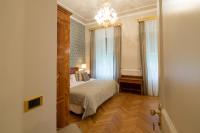 A bed or beds in a room at Imperiale Palace Hotel
