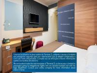 TRYP BY WYNDHAM São Paulo Airport - Hotel de Transito Terminal 3 -Lado Ar - Área restrita á passageiros já embarcados - Piso 1にあるテレビまたはエンターテインメントセンター