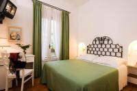 Postel nebo postele na pokoji v ubytování Hotel Villa Angelica