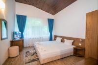 Postel nebo postele na pokoji v ubytování Family Park Hotel Kyoshkove
