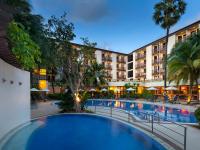 a large swimming pool in front of a hotel at Ibis Phuket Patong in Patong Beach