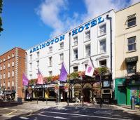 a white building with a hotel sign on it at Arlington Hotel O'Connell Bridge in Dublin
