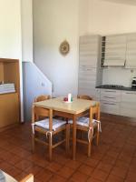 A kitchen or kitchenette at Domus Carlotta Apartment with sea view Villasimius