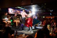a group of people dancing on a stage at Arlington Hotel O'Connell Bridge in Dublin