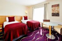 a hotel room with two beds and a window at Arlington Hotel O'Connell Bridge in Dublin