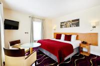 a hotel room with a bed with a red blanket at Arlington Hotel O'Connell Bridge in Dublin
