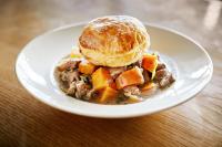 a plate of food with a pastry on a table at Arlington Hotel O'Connell Bridge in Dublin