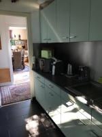 a kitchen with a sink and a counter top at TOPFLOOR Les Terrasses in Dieppe