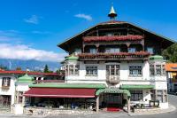 a large building with flowers on top of it at Sporthotel Igls in Innsbruck