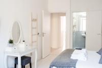 Łóżko lub łóżka w pokoju w obiekcie White Fanti Apartment