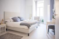 Łóżko lub łóżka w pokoju w obiekcie White Fanti Apartment